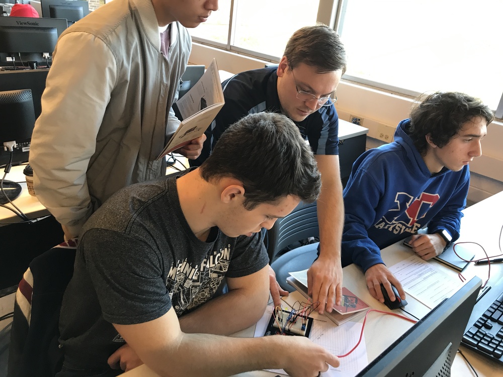 Honda engineers work with OHP students in the classroom.